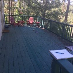 BEFORE- Outdoor deck with red wooden chairs