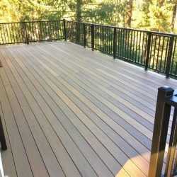 AFTER- new wooden deck with black railing