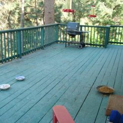 BEFORE- wooden deck and rail painted aqua/teal color