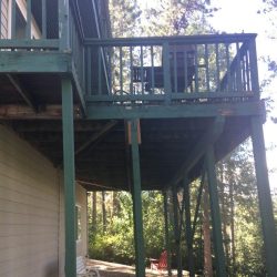 BEFORE- green wooden deck second floor